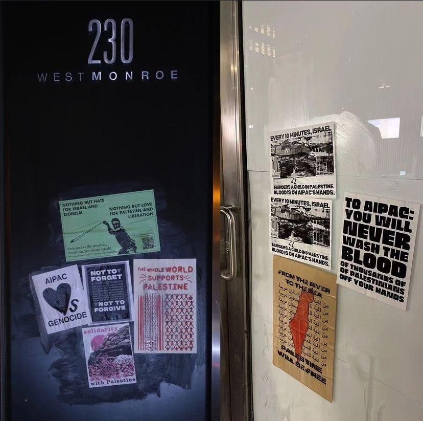 wheatpasted pro palestine posters on building